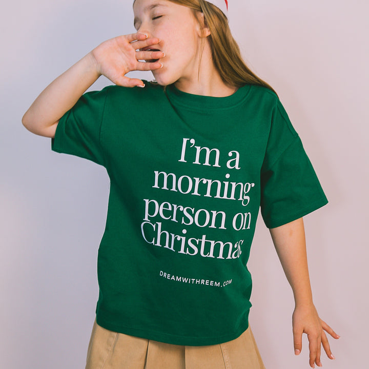 Green Christmas morning t-shirt featuring 'I'm a morning person on Christmas' text design