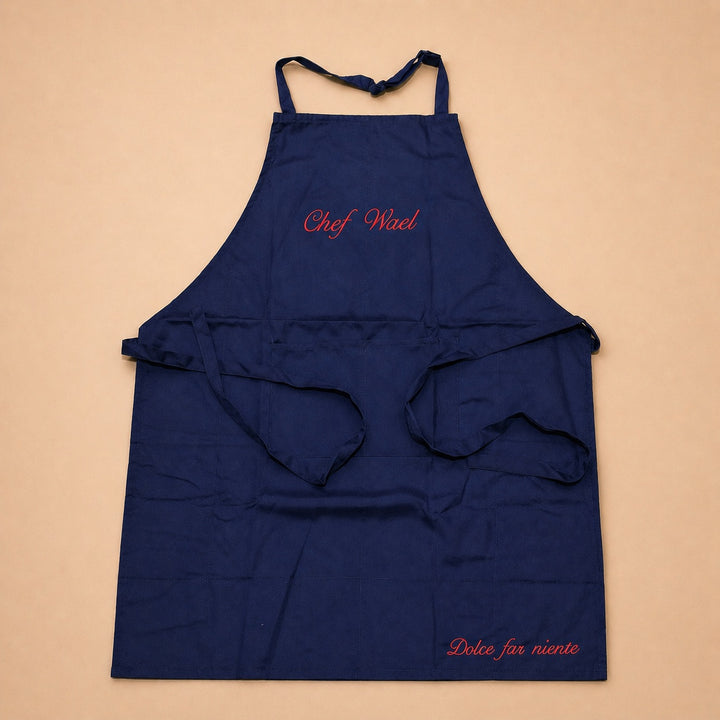 Personalized custom apron in navy blue with red embroidery for chefs and home cooking enthusiasts