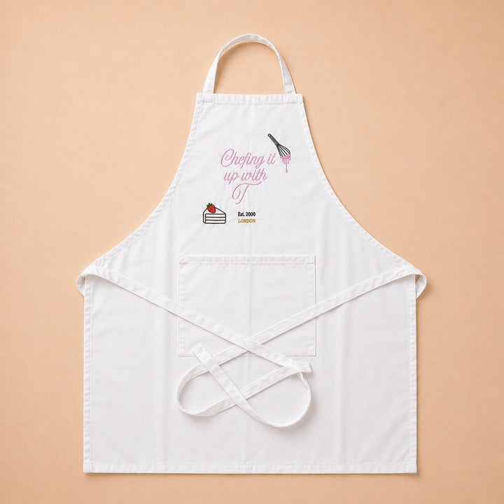 Custom apron with a baking theme featuring a cake graphic and the phrase Chopping it up with