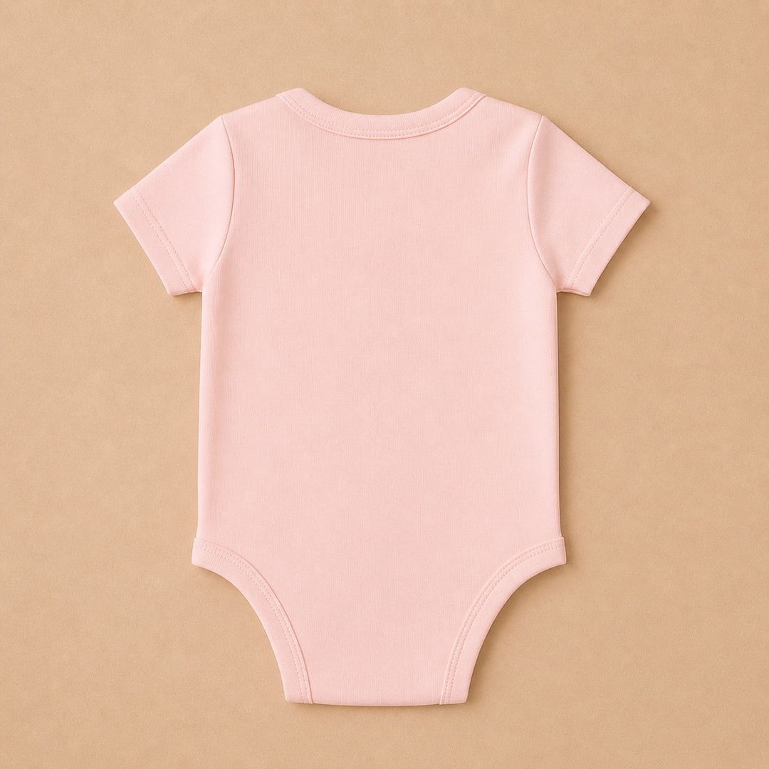 Back view of a soft pink custom baby onesie perfect for personalized gifts