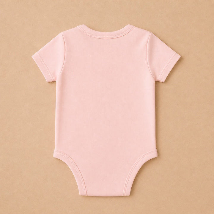 Back view of a soft pink custom baby onesie perfect for personalized gifts