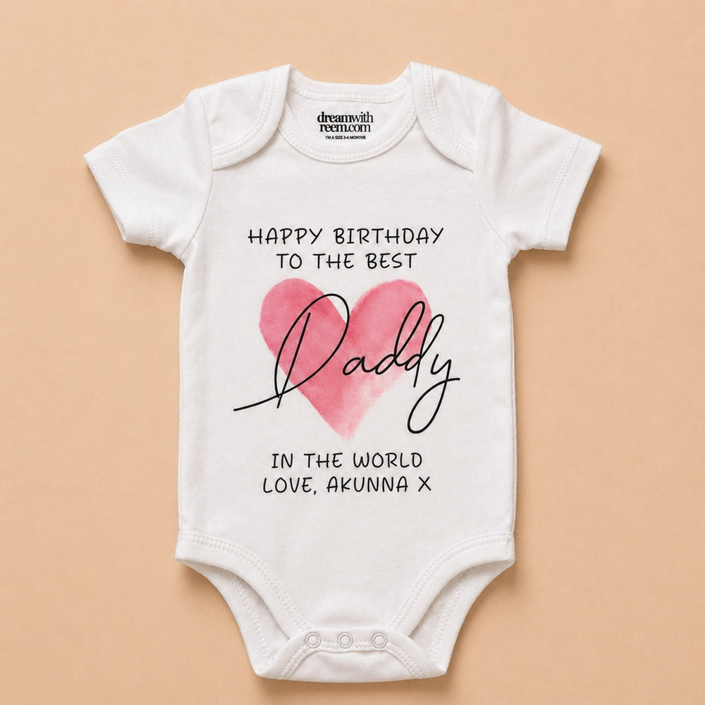Custom baby onesie with a heart design and birthday message for Daddy in a stylish font