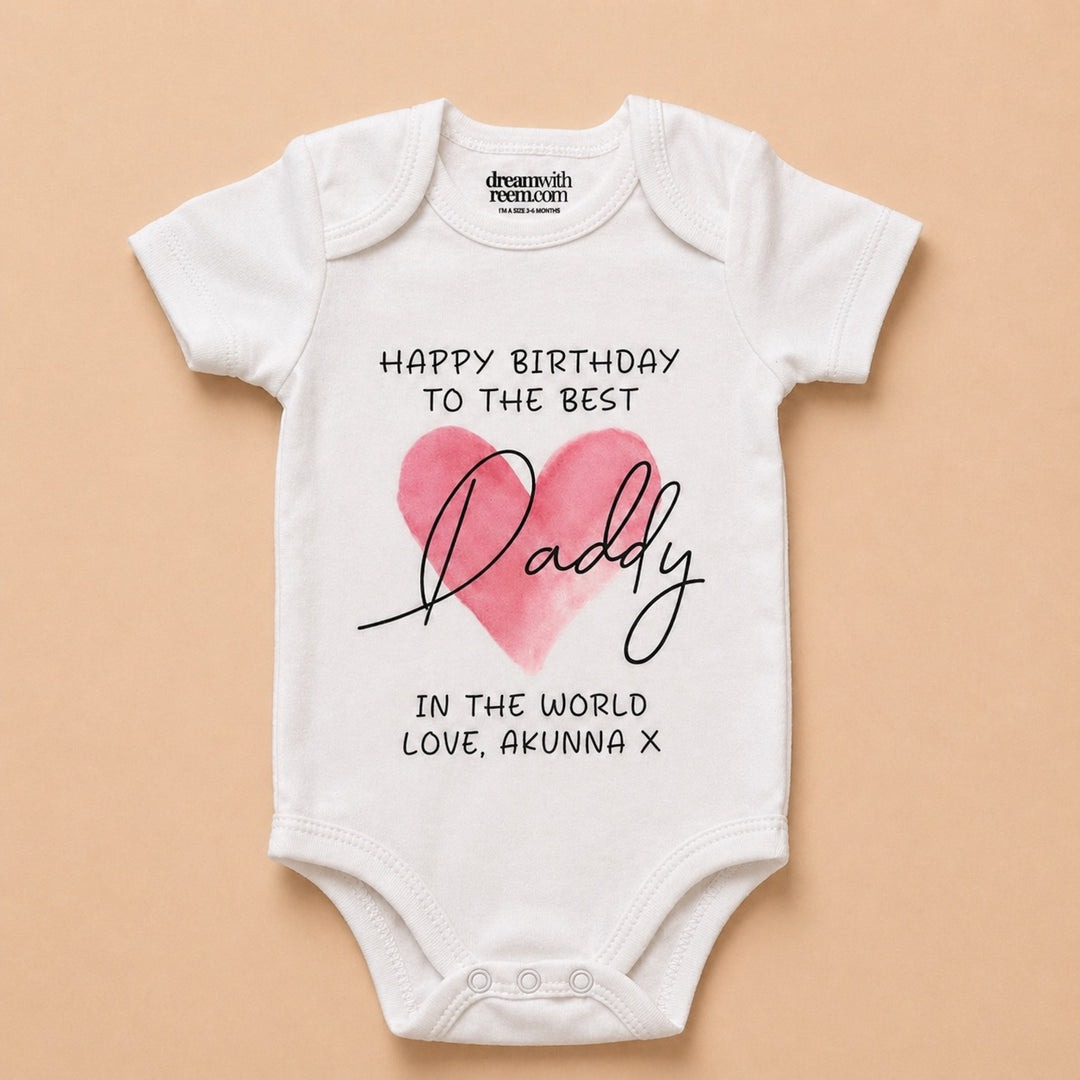 Custom baby onesie with a heart design and birthday message for Daddy in a stylish font