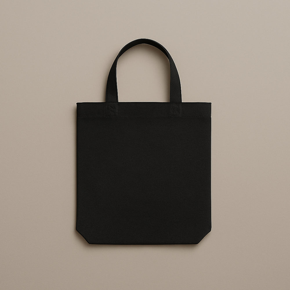 Black custom canvas tote bag with sturdy handles perfect for everyday use