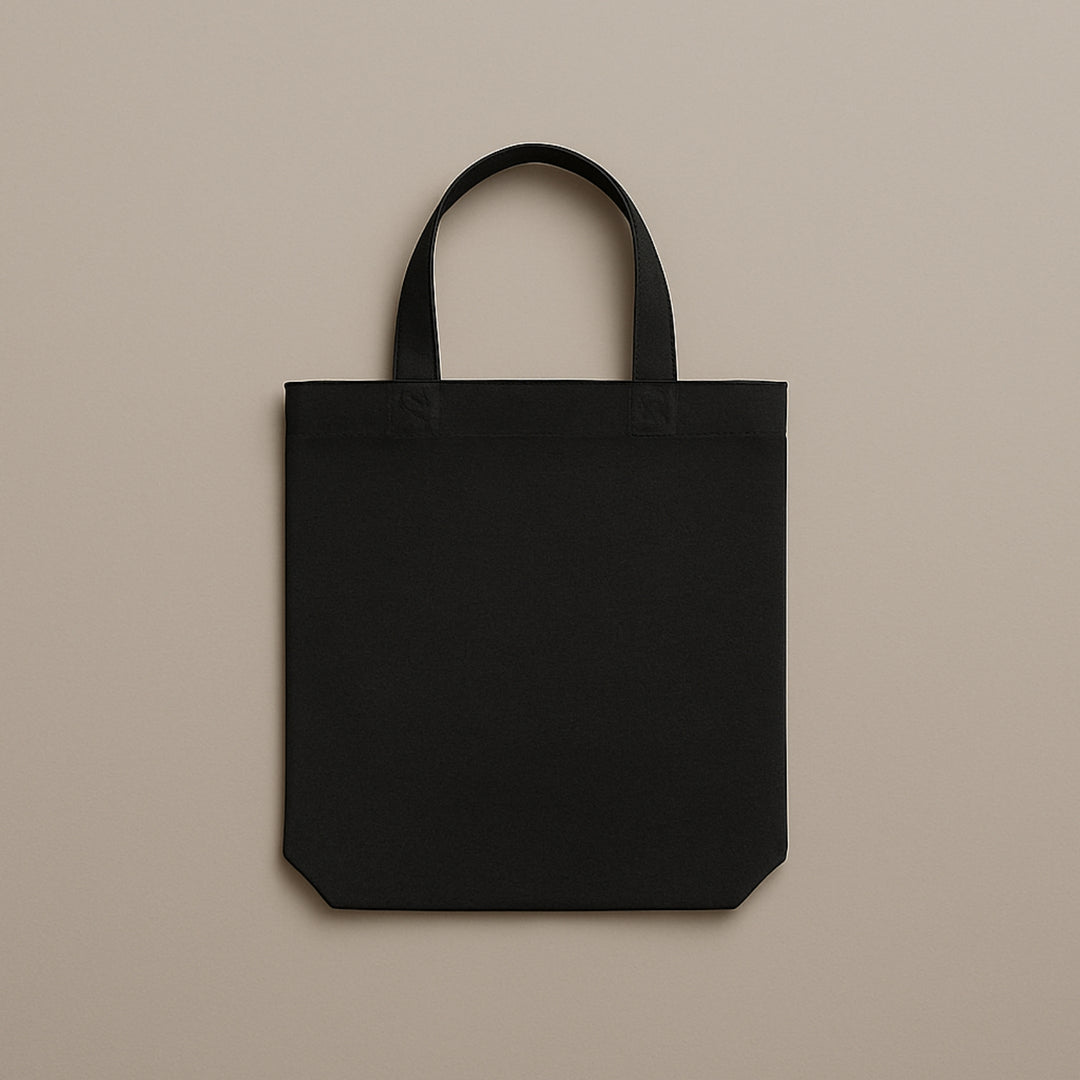 Black custom canvas tote bag with sturdy handles perfect for everyday use