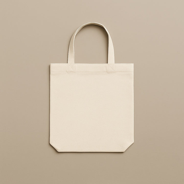 Dreamwithreem plain beige custom canvas tote bag with sturdy handles on neutral background
