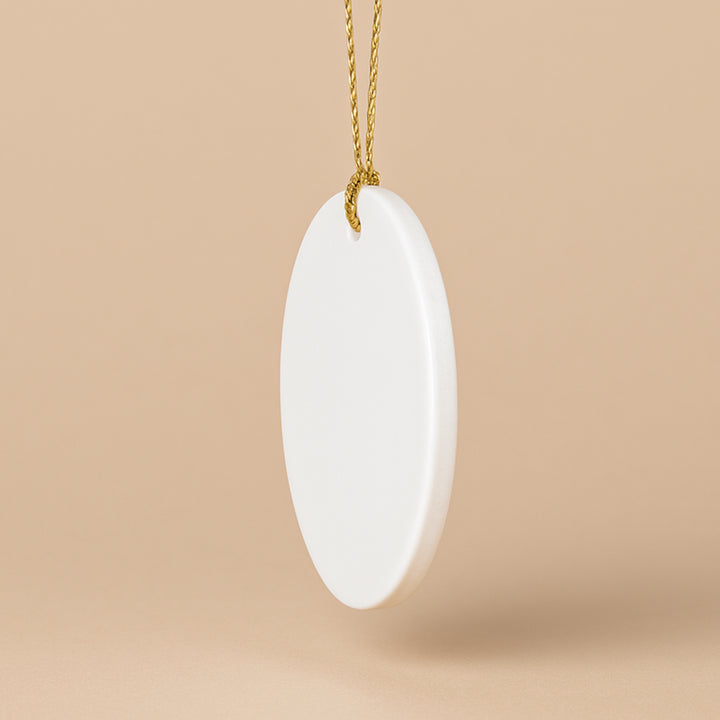 Custom ceramic ornament in a plain white finish, perfect for personalized holiday gifts