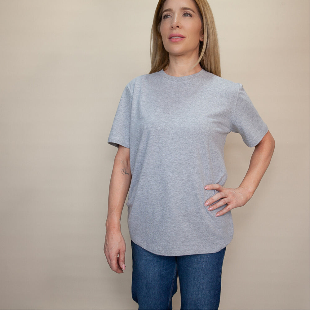 Woman wearing a light gray custom classic fit t-shirt with short sleeves and a relaxed style