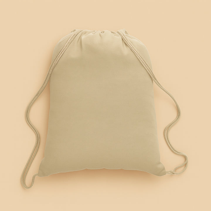 Beige custom cotton drawstring bag with adjustable straps for everyday use and travel
