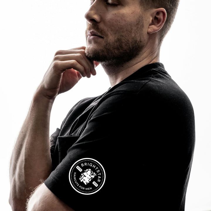 Custom DTF print service featured on a stylish black men's shirt with logo detail