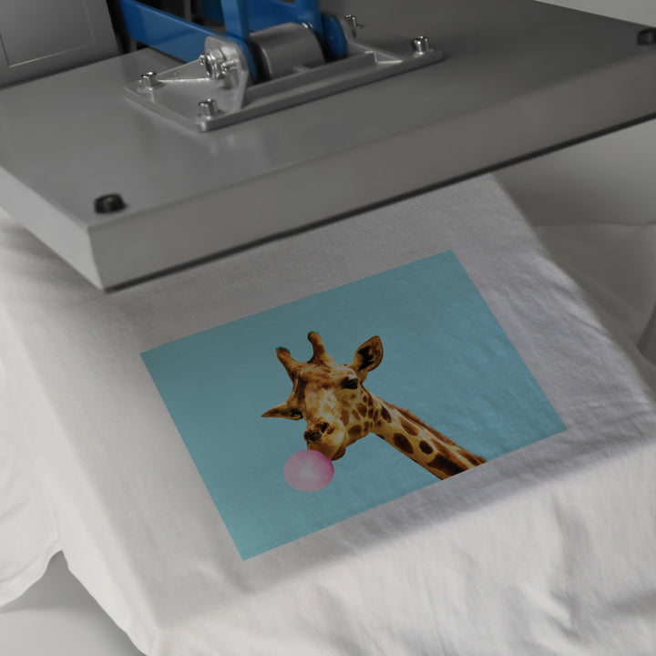 Giraffe design on a t-shirt being pressed with custom DTF print service for vibrant custom prints
