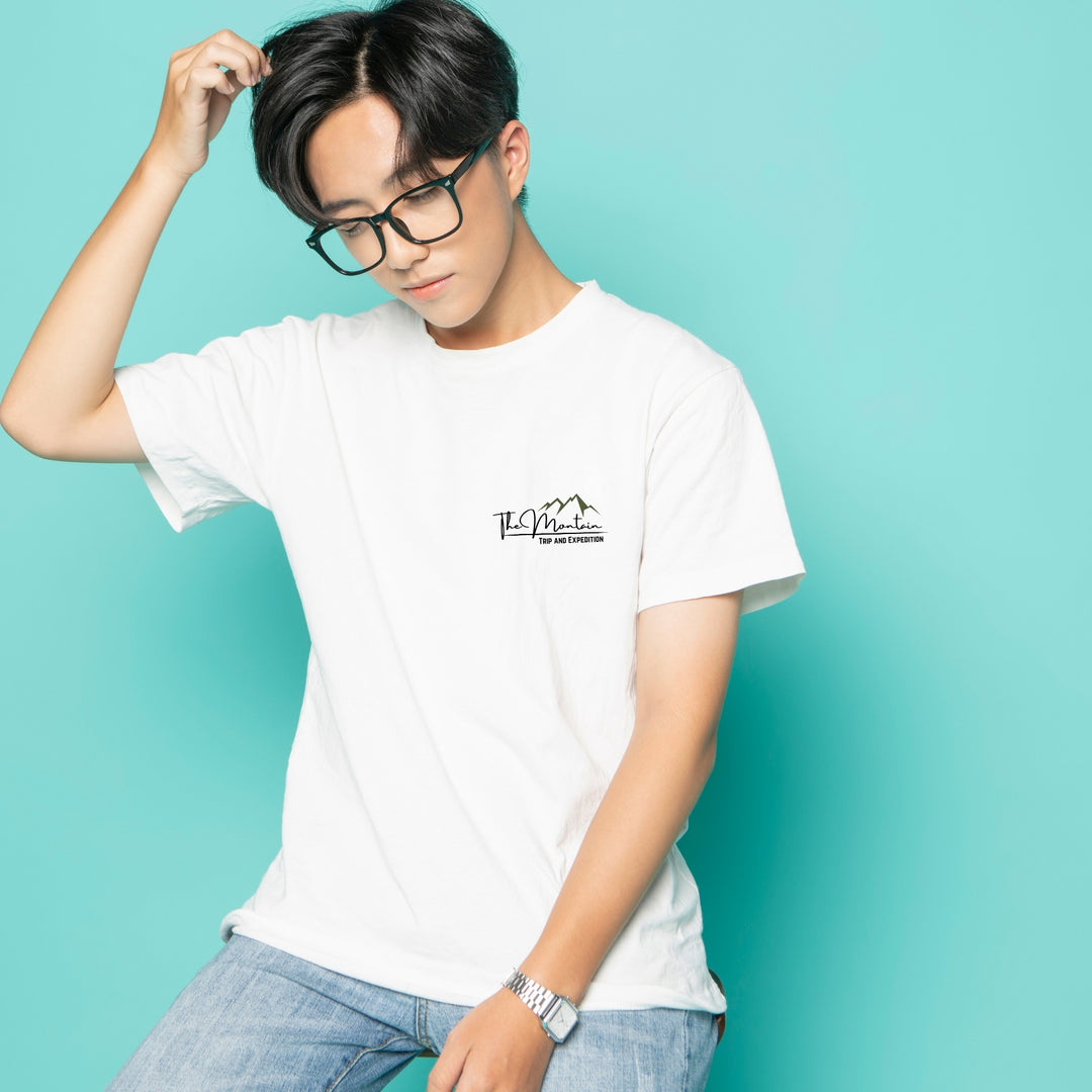 Custom DTF print service on a white t-shirt featuring a minimalist mountain design