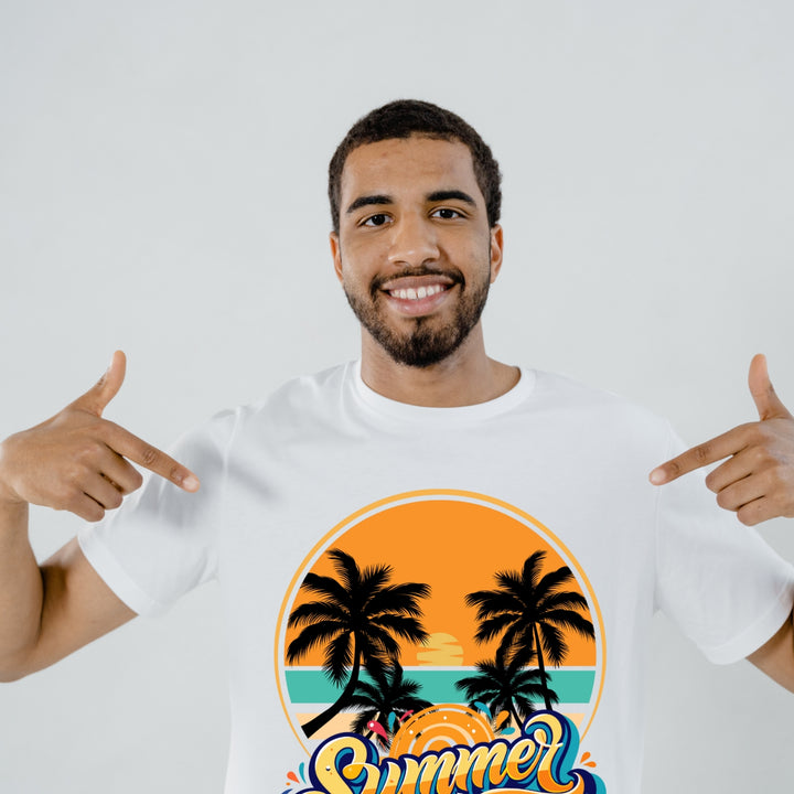 Man wearing a white t-shirt showcasing vibrant custom DTF print service featuring tropical sunset and palm trees