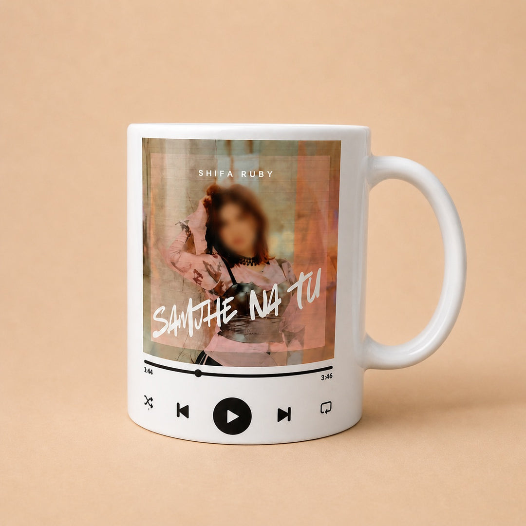 Custom mugs featuring a personalized music design with an artist name and song time display