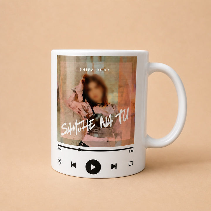 Custom mugs featuring a personalized music design with an artist name and song time display