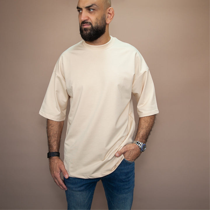 Custom oversized tee in beige, featuring a relaxed fit and soft fabric, perfect for casual wear