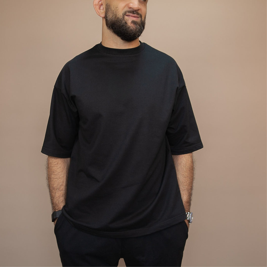 Custom oversized tee in black, featuring a relaxed fit and soft fabric for everyday wear