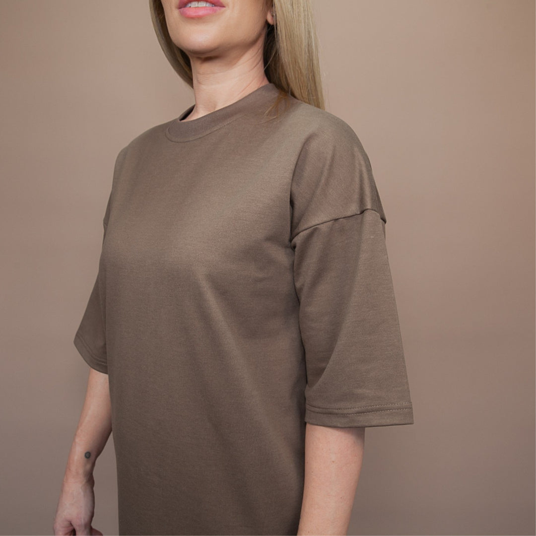 Model wearing custom oversized tee in brown for a relaxed and stylish look