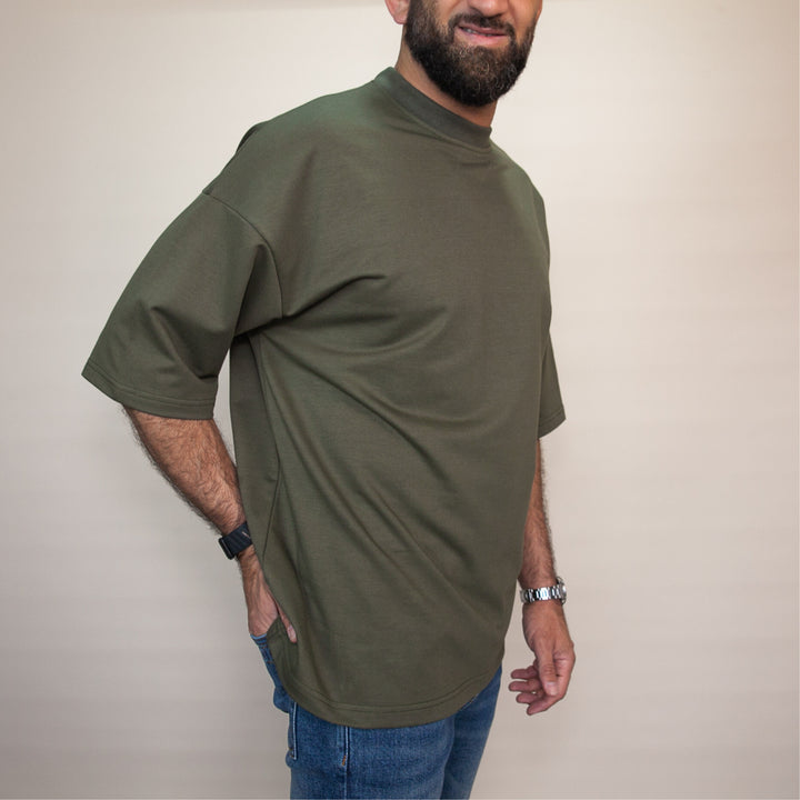 Custom oversized tee in olive green with a relaxed fit for casual and comfortable wear