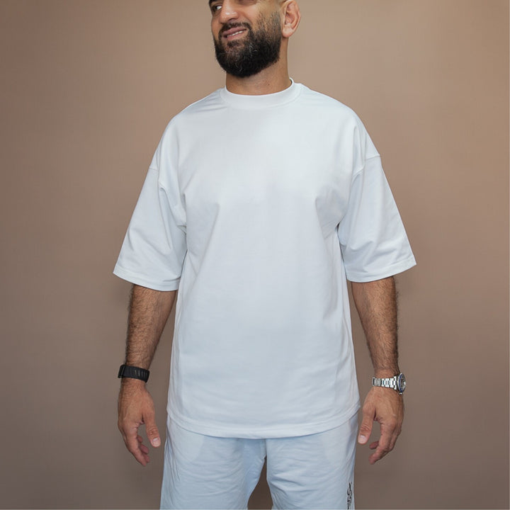 Custom oversized tee in white, featuring a relaxed fit and comfortable fabric for everyday wear