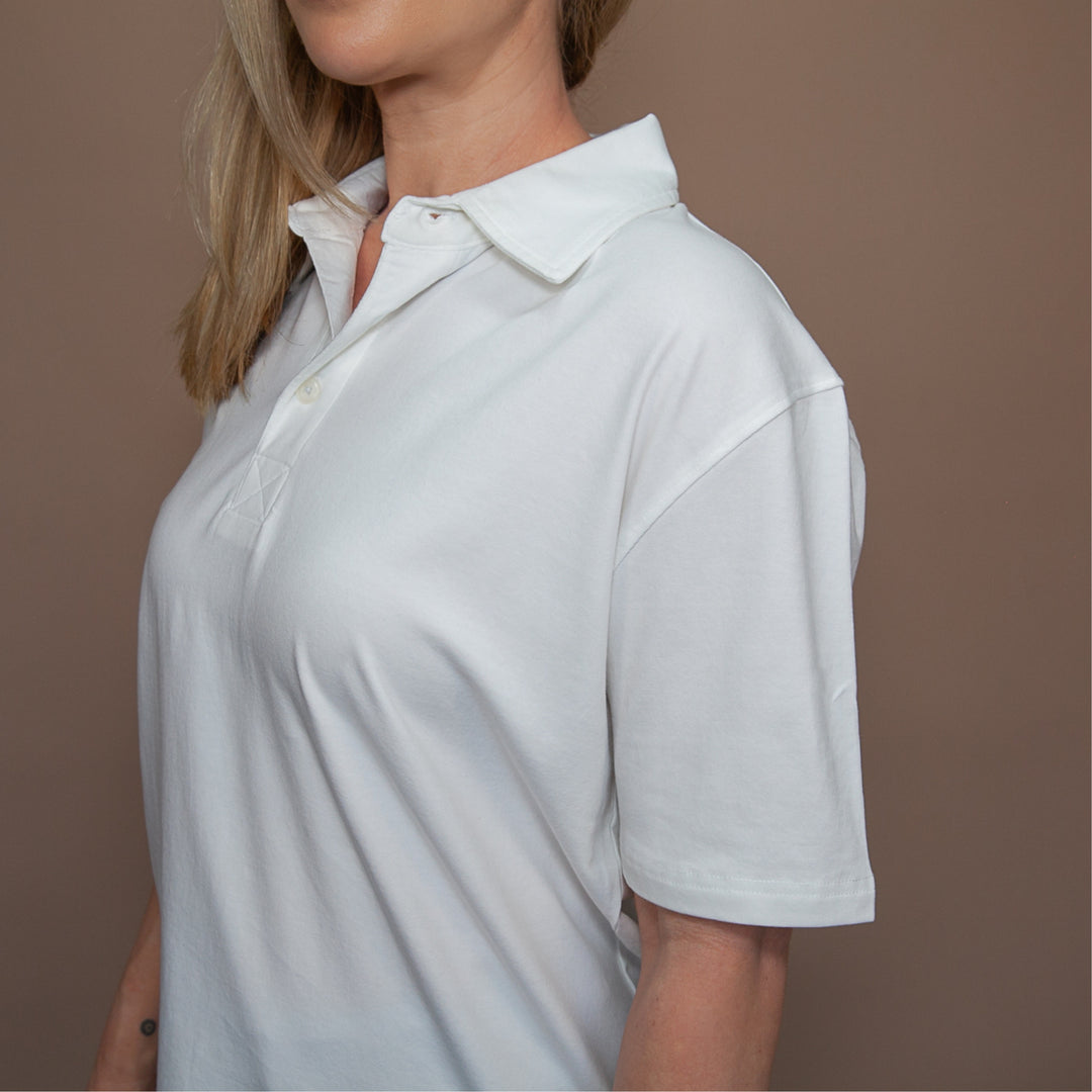 Dreamwithreem custom polo t-shirt in white, featuring a relaxed fit and classic collar design