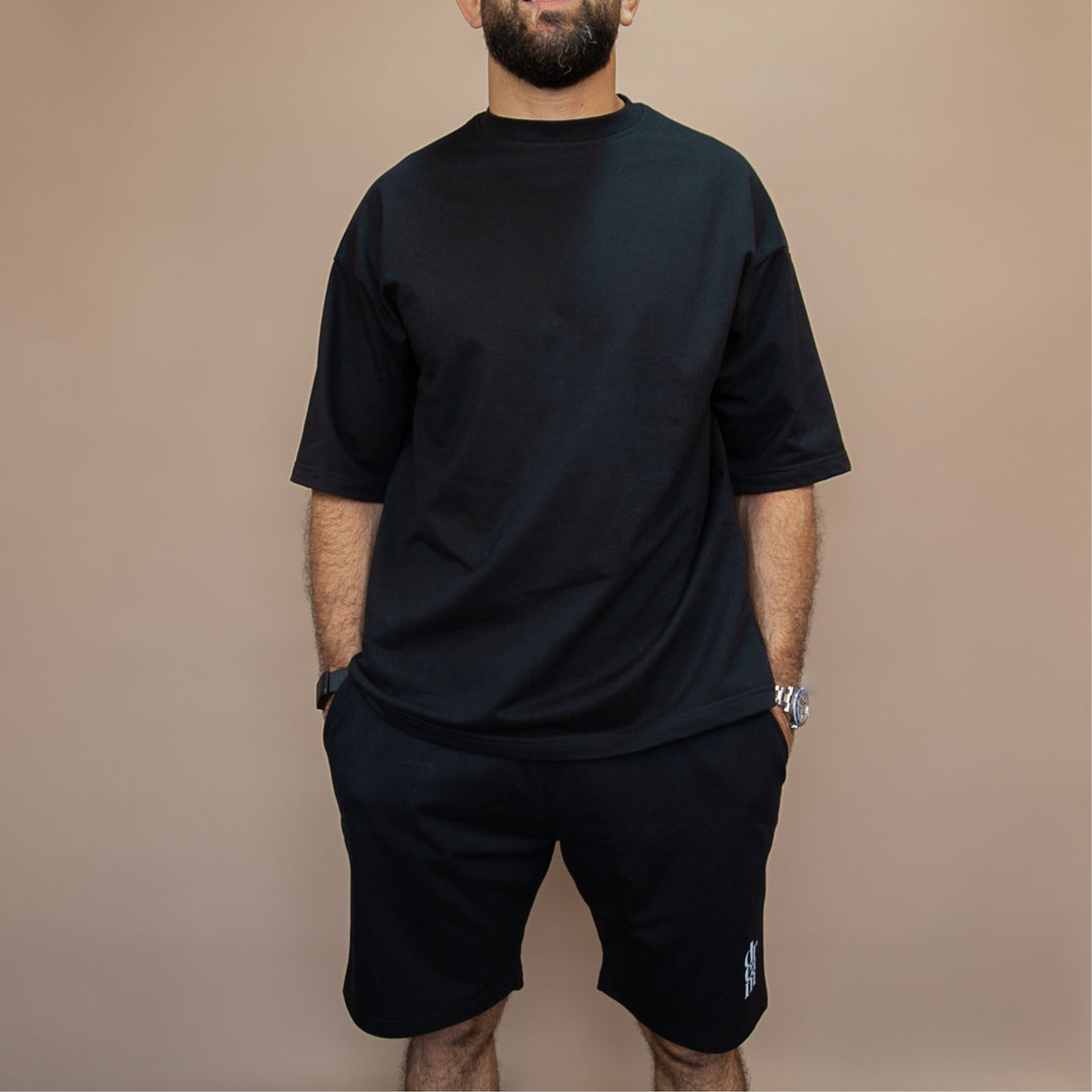 Stylish black custom two-piece set with relaxed fit t-shirt and shorts for casual wear
