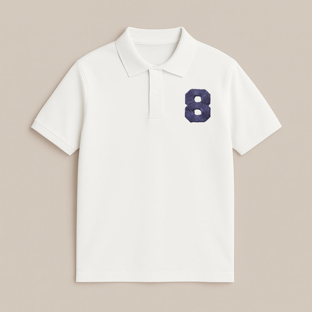 White custom printed polo shirt by dreamwithreem with navy textured number 8 on left chest