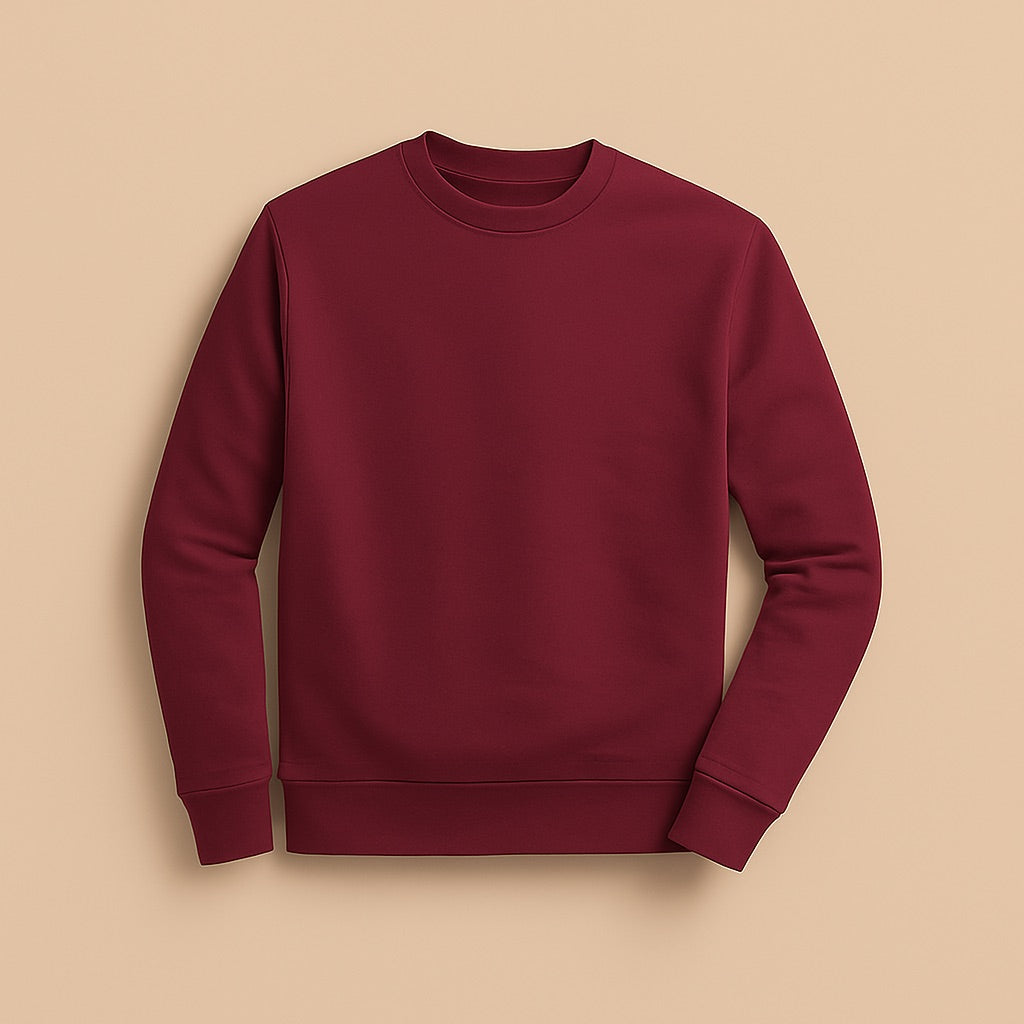 Burgundy crewneck jumper laid flat on beige background from dreamwithreem to design your own sweatshirt online