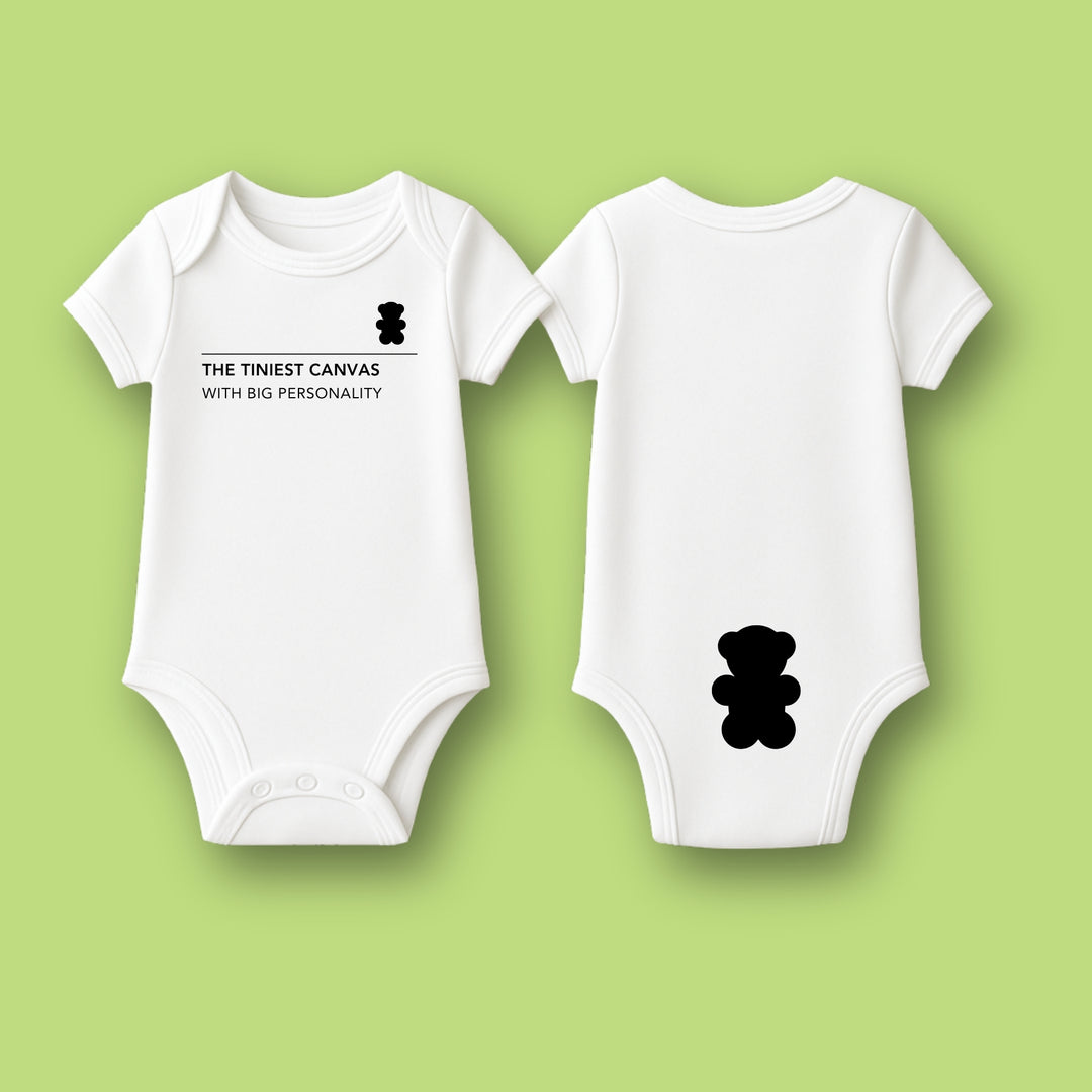 White personalized infant bodysuit with black teddy bear graphic and text on front and back