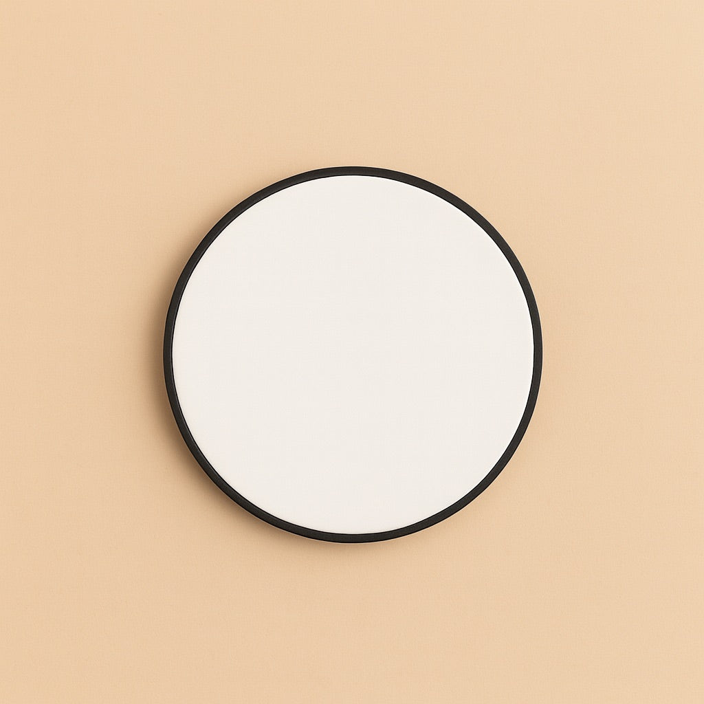 Customizable mobile phone accessory in round shape with a solid white surface and black border
