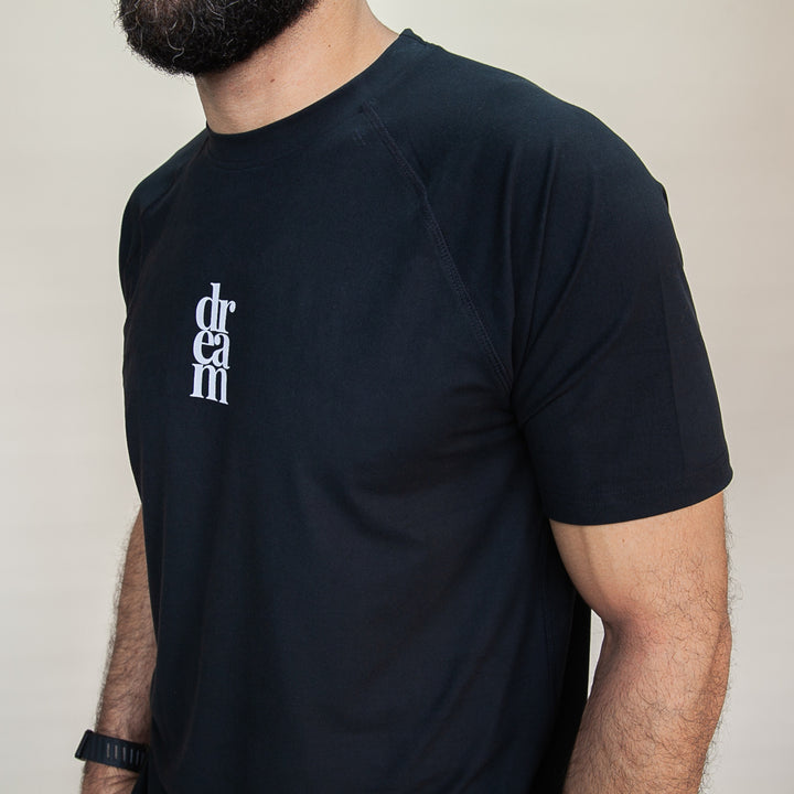 Custom black T-shirt from dreamwithreem, showcasing expressive fitness apparel design for activewear