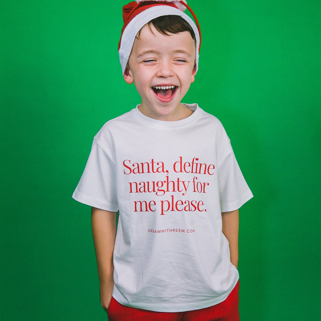 Funny Christmas shirt for kids featuring the phrase Santa define naughty for me please