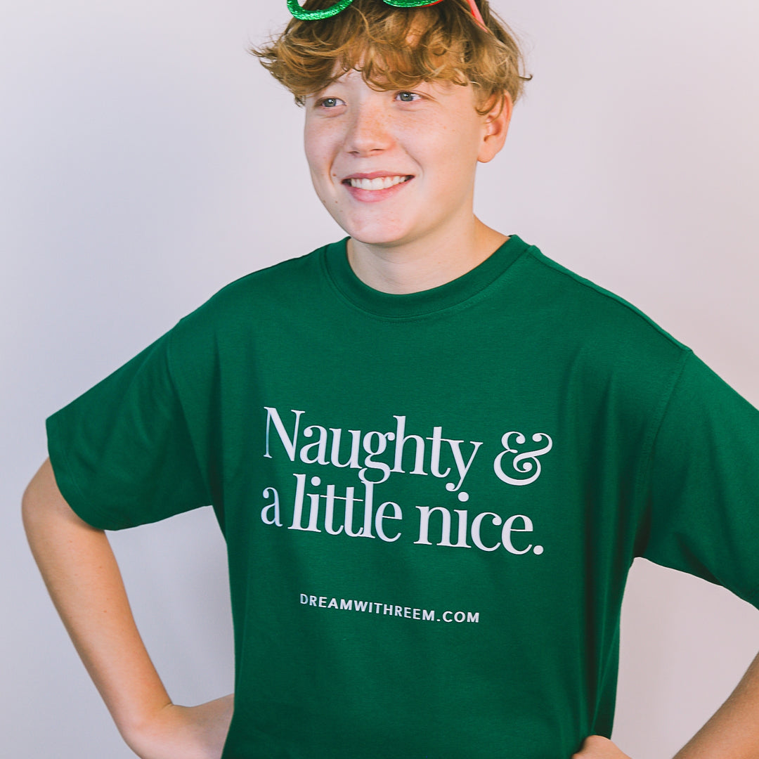 Funny Christmas shirt for teens featuring a playful design in green with white text