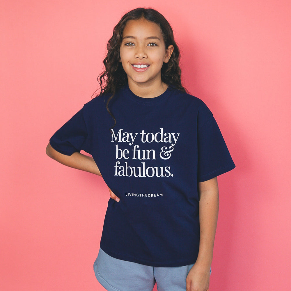 Girl wearing navy blue fashionable custom shirts with fun and fabulous text design by dreamwithreem