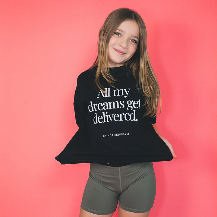 Girl wearing a custom one-of-a-kind statement shirt by dreamwithreem that says All my dreams get delivered