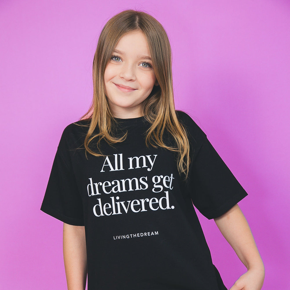Girl wearing a custom one-of-a-kind statement shirt by dreamwithreem with All my dreams get delivered text