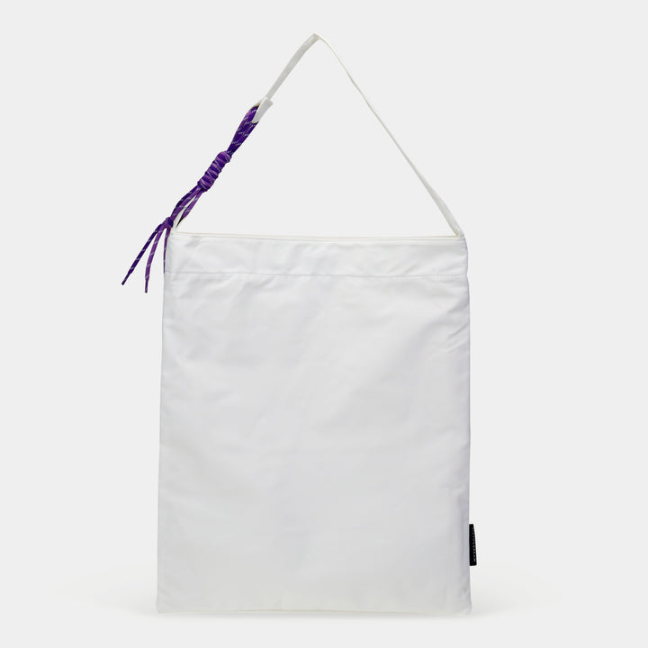 White fabric tote bag with purple braided detail and Custom Tote Zipper Pocket for secure storage