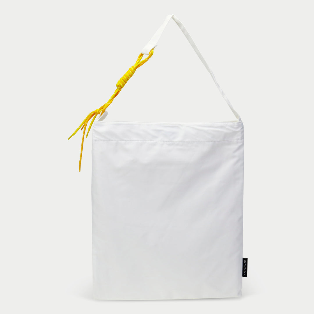 Dreamwithreem white custom tote zipper pocket bag with adjustable strap and yellow knot detail
