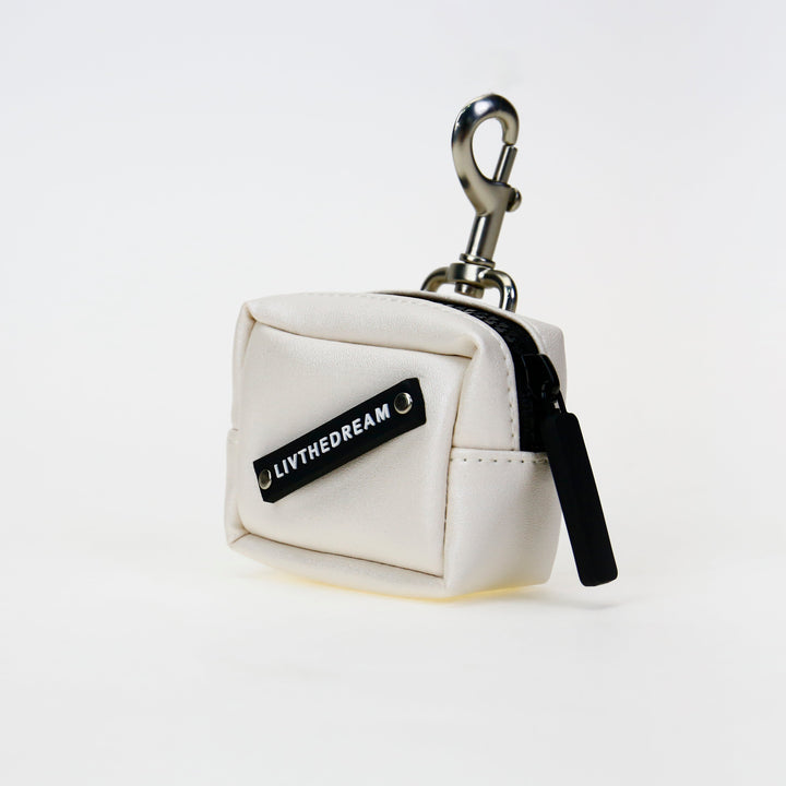 White small pouch keychain with LIVTHEDREAM label and metal clip unique fashion accessories