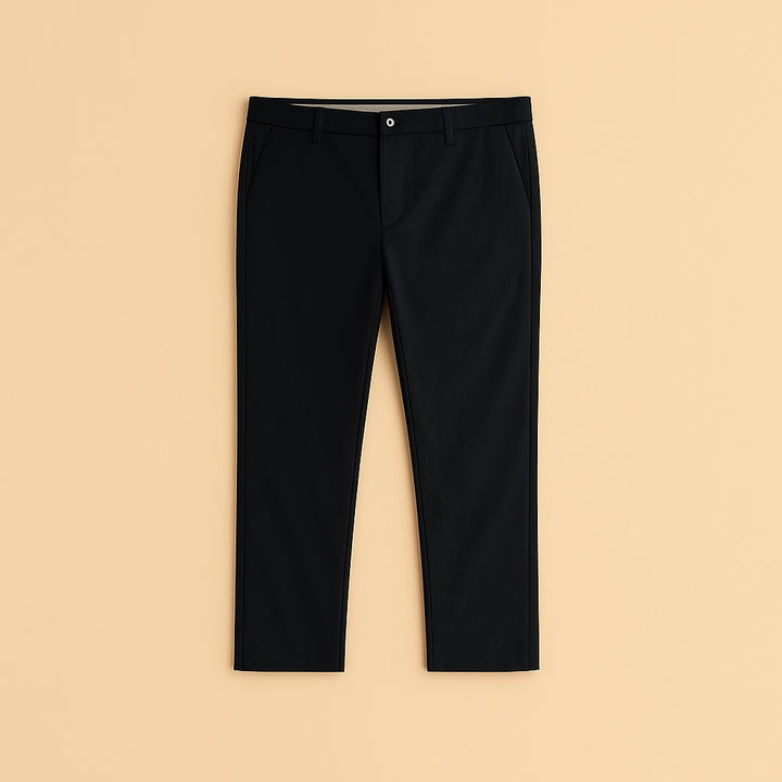 Black personalized chino trousers flat lay on beige background tailored slim fit mid rise casual office pants