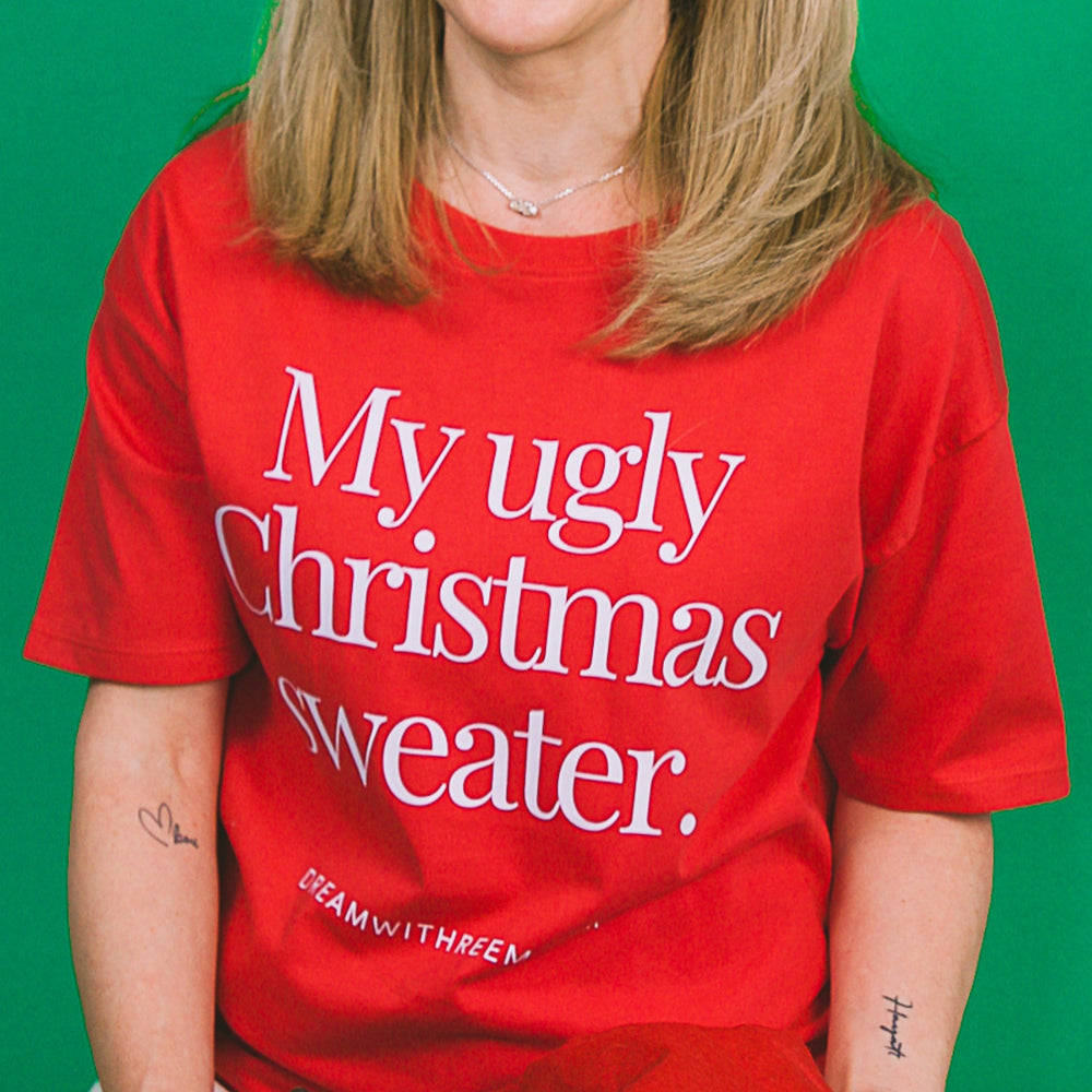 Red custom T-shirt featuring the phrase My ugly Christmas sweater, ideal as a novelty Christmas tee gift