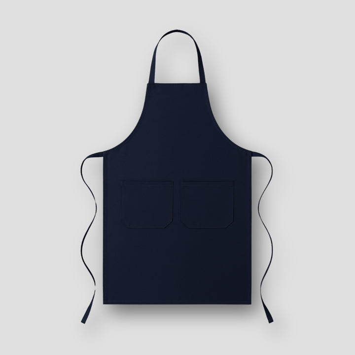 Solid navy blue apron with two front pockets perfect for personal expression aprons