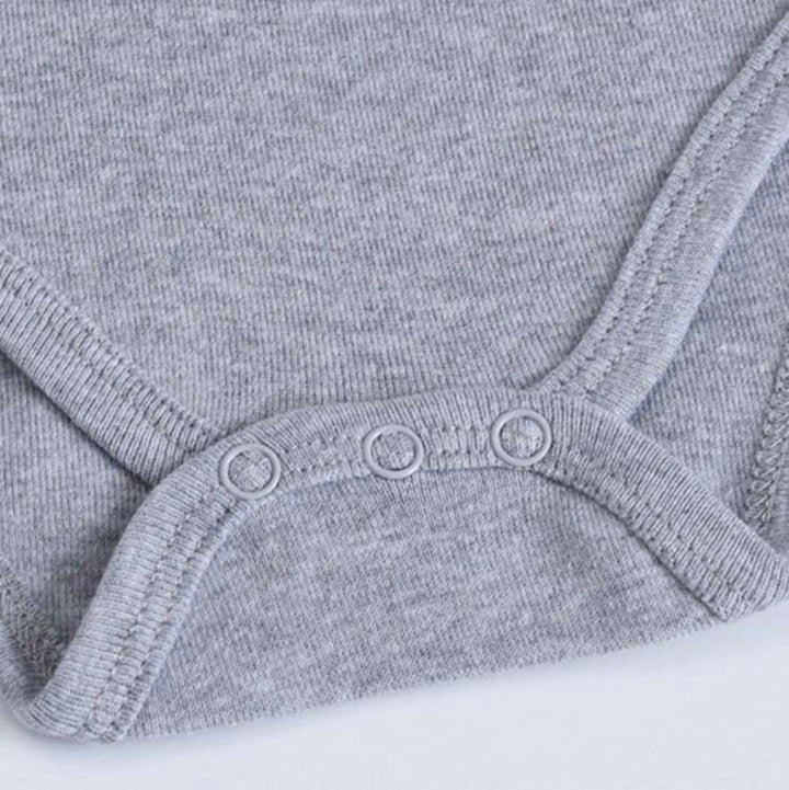 Close-up of a gray personalized baby bodysuit with snap closures for easy dressing