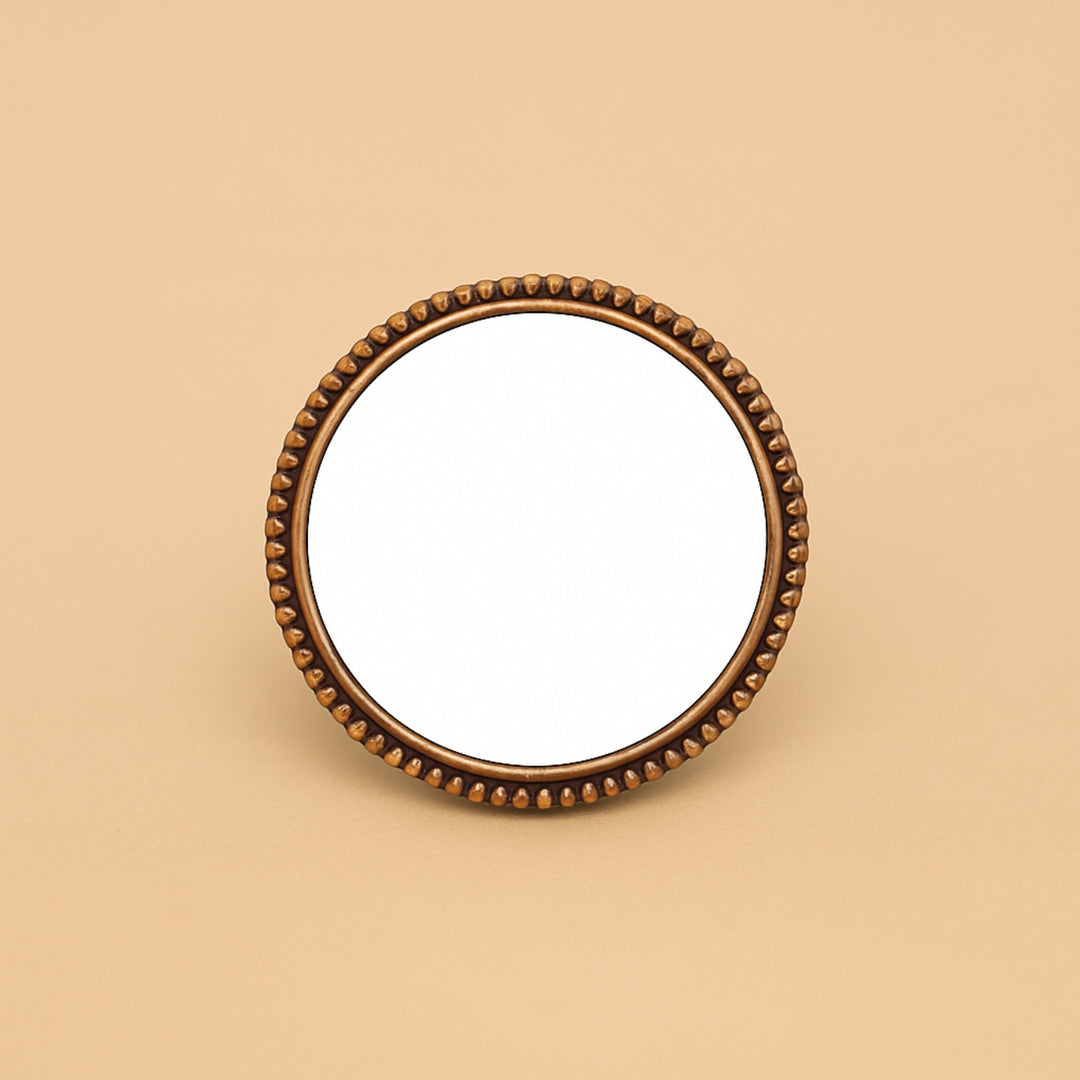 Round compact mirror with decorative bronze edges for personalized hair accessories