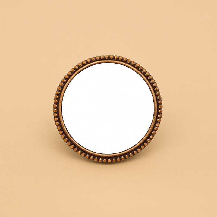 Round compact mirror with decorative bronze edges for personalized hair accessories