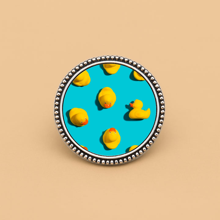 Personalized hair accessories featuring a playful design with yellow rubber ducks on a blue background