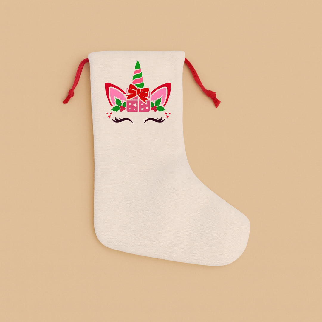 Personalized holiday stocking featuring a cute unicorn design with festive colors and embellishments