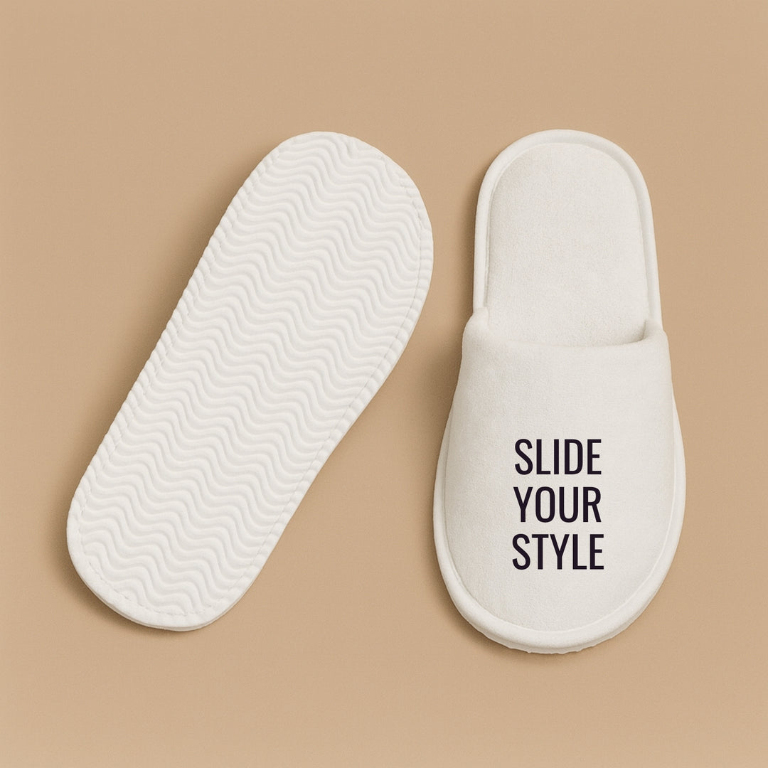 Personalized hotel slippers in white with the text Slide Your Style for ultimate comfort and relaxation