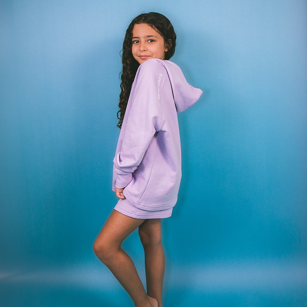 Young girl wearing a personalized purple hoodie outfit by dreamwithreem posing against a blue background