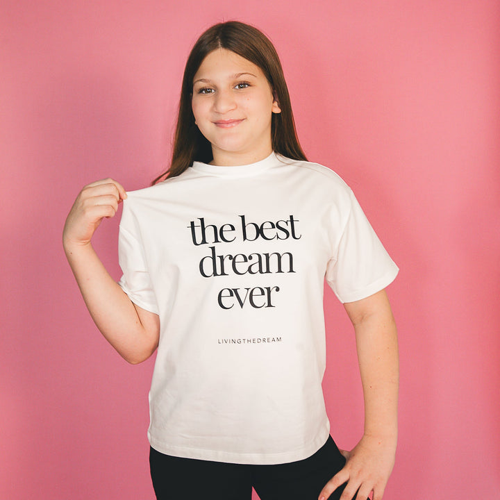 Girl wearing custom T-shirt with the best dream ever text from dreamwithreem personalized statement shirts